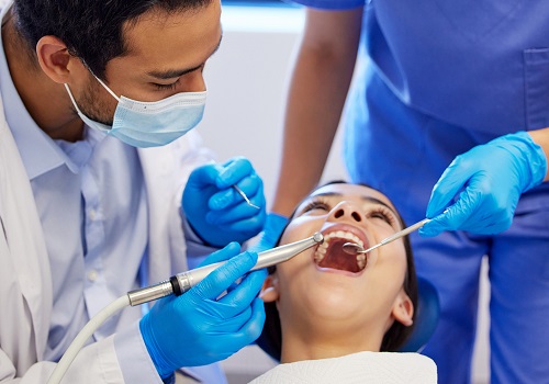 A dental exam of a child is seen in progress. Associates in Dentistry is a dentist in Peoria IL.