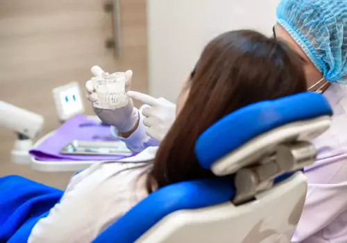 A woman is seen receiving dental services. Associates In Dentistry performs Restorative Dentistry in Peoria IL.