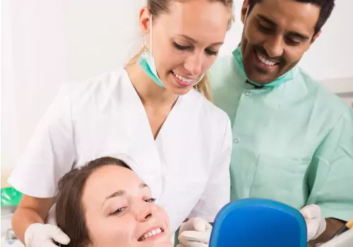 A woman is seen receiving dental care. Associates In Dentistry is a Family Dentist.