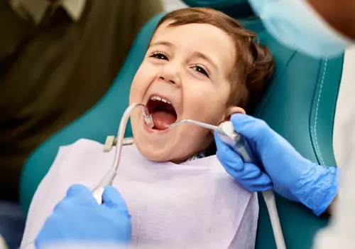 A child is seen at the dentist. Associates In Dentistry is a Local Dentist in Washington IL.