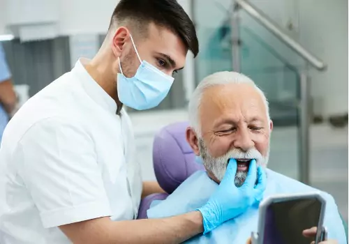 A patient is seen receiving services. Associates In Dentistry is a Local Dentist near East Peoria IL