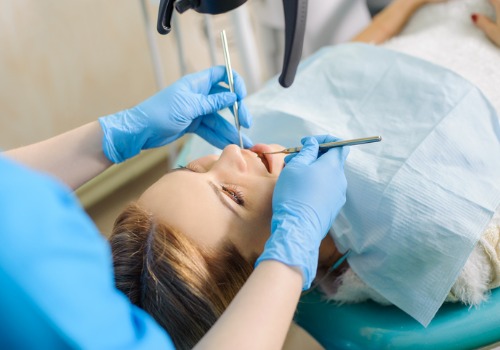 Girl at dentist receiving services for root canals in Washington IL.