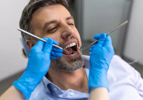 A patient is seen receiving dental care. Associates In Dentistry is one of the top central Illinois dentists.