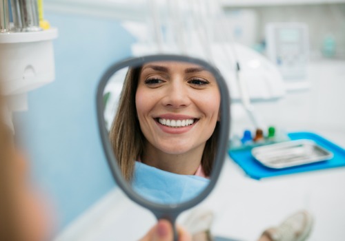 A patient is seen smiling at the dentist. Associates In Dentistry is a dentist in central Illinois.