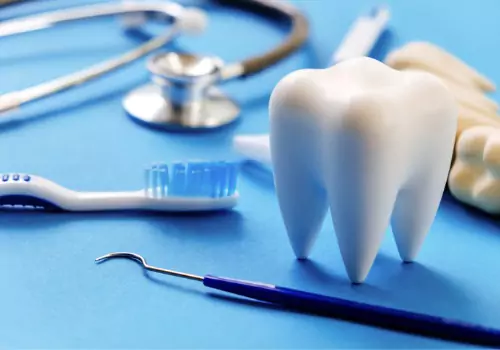 A model of a tooth and tools used by a dentist for Peoria IL